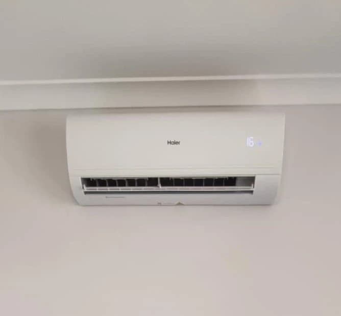 Haier split-system indoor unit installed on a white wall