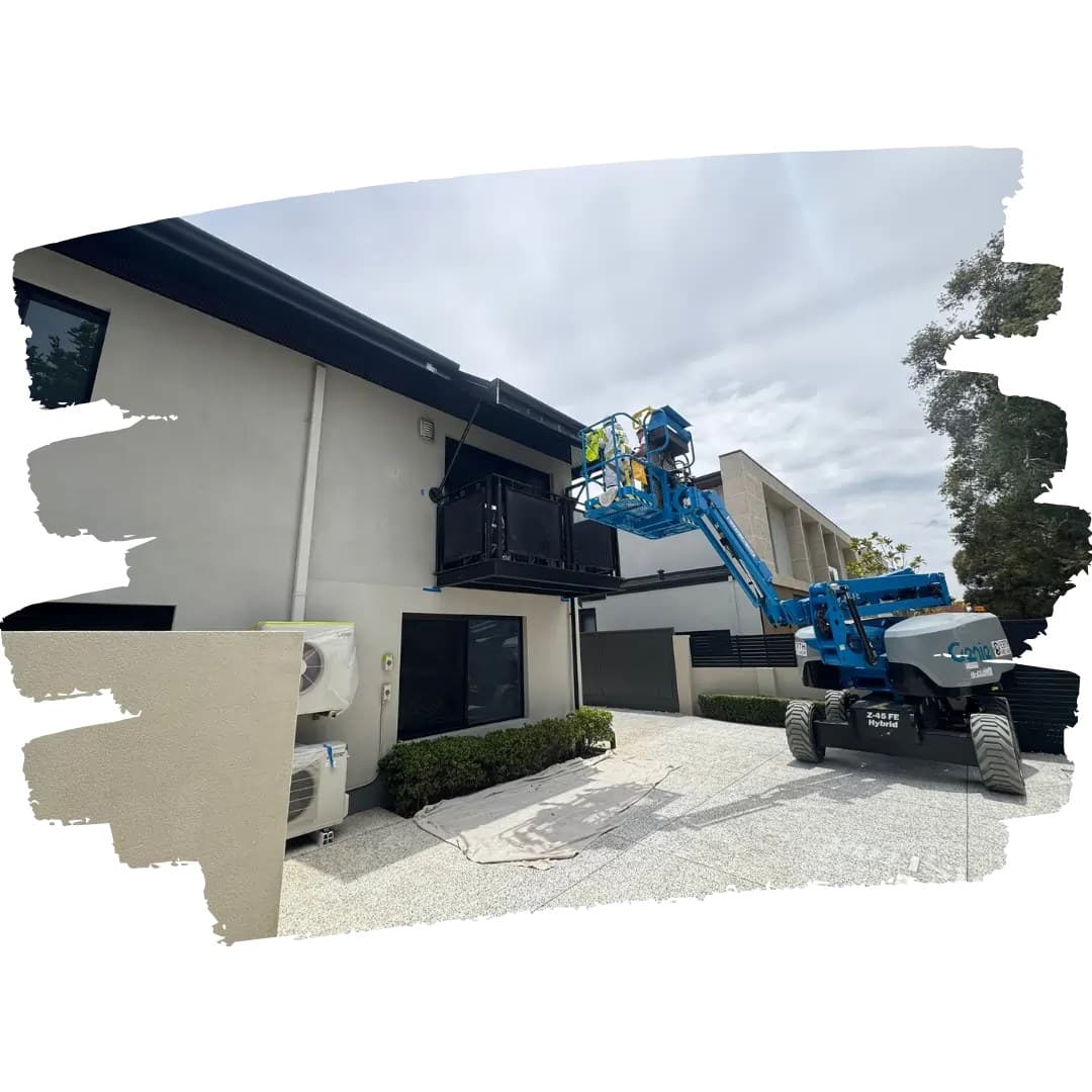 Cherry picker beside a rendered house with drop sheets on the driveway