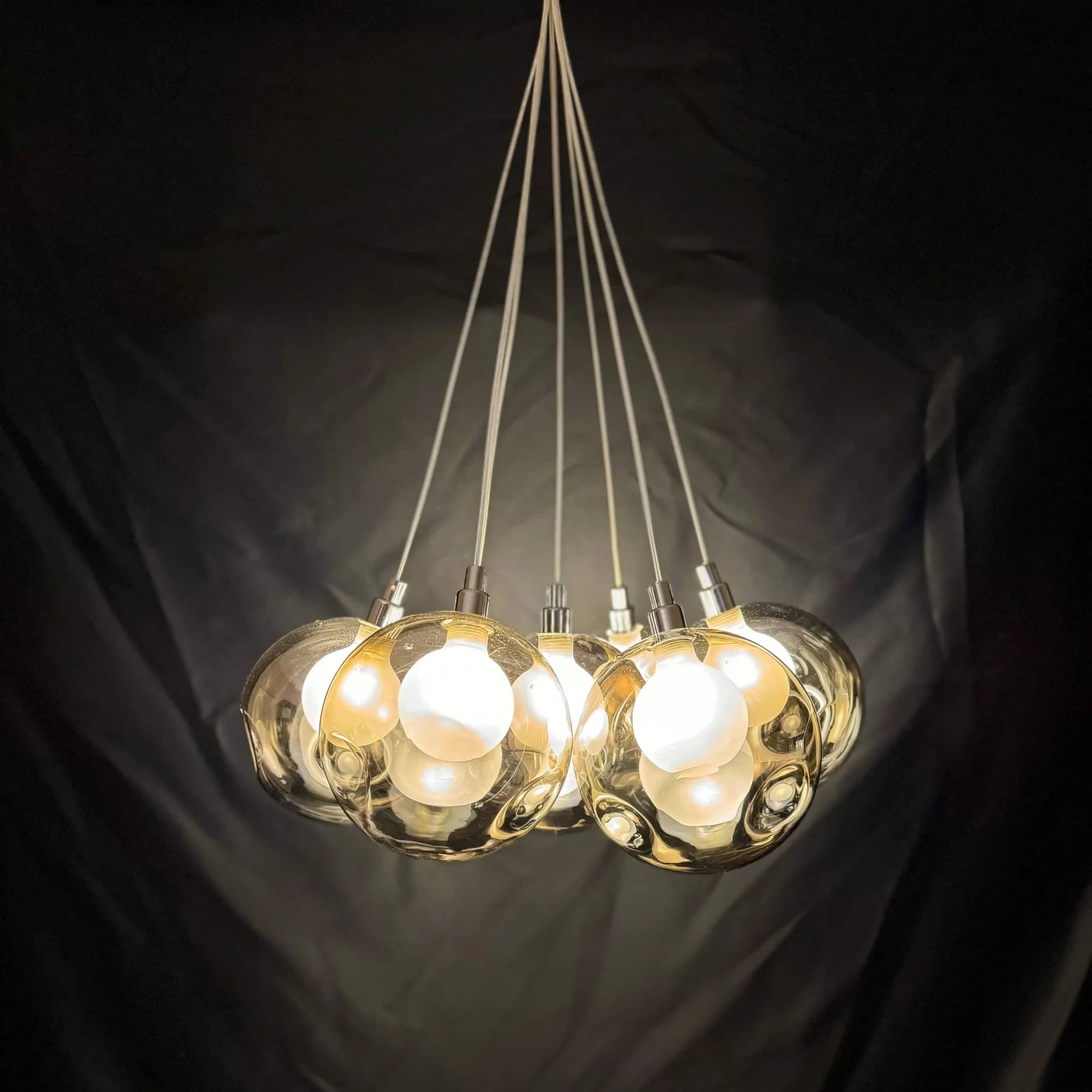 Cluster of glass globe pendant lights from the Hiddlestone lighting shop