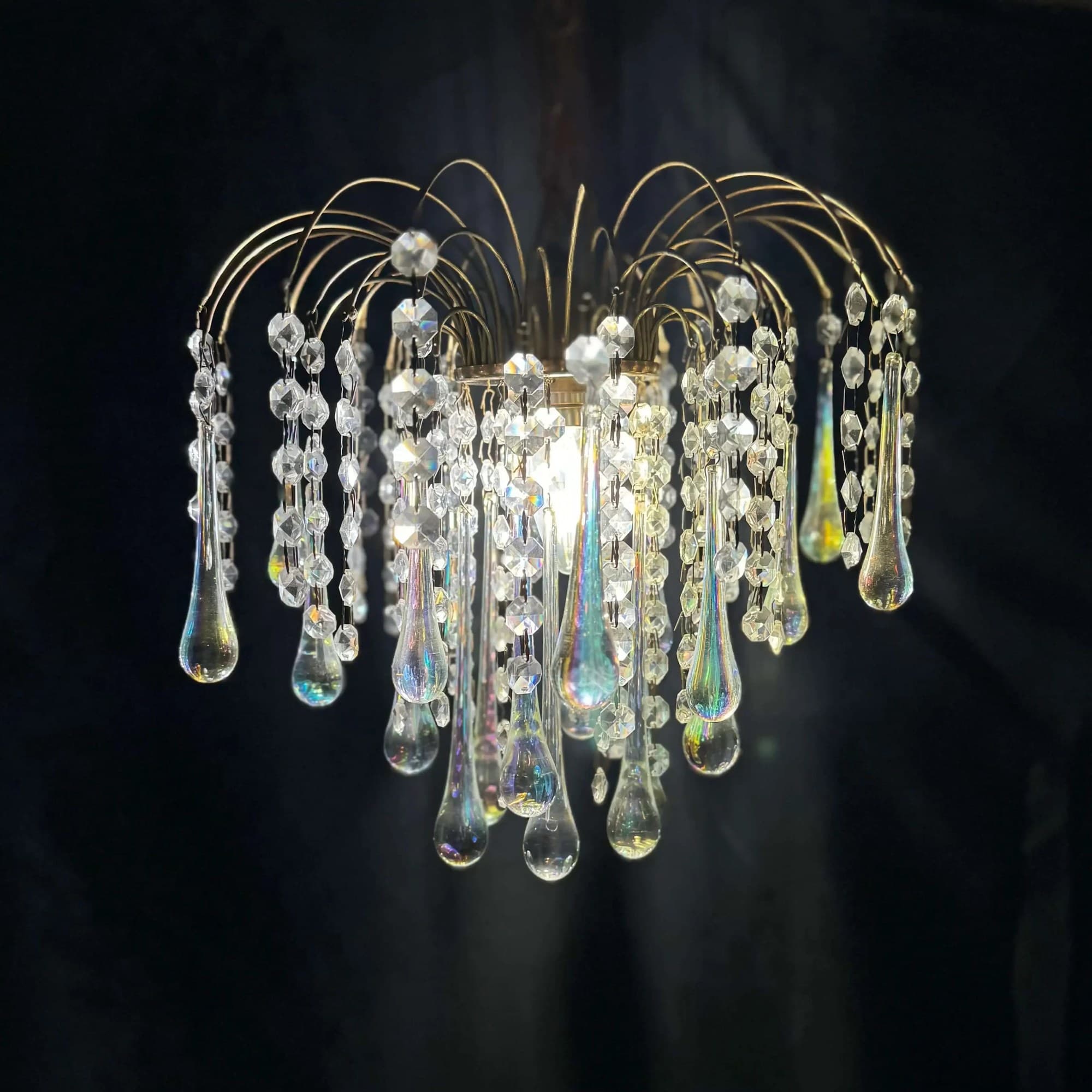Crystal chandelier with glass drops, photographed for the lighting shop